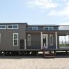 The Meadowview model P-528 by Platinum Cottages Malakoff and on display at RRC Athens Tx. This beautiful model features a wraparound porch, a loft, and a rock fireplace w/ built in bookshelves.