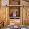 Double barn door closets in the Meadowview model by Platinum Cottages and RRC Athens. Also shown with full SYP stained interior package.