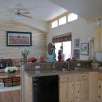 Blue Ponderosa Pine full accent wall next to a three window clerestory on display at Recreational Resort Cottages in Rockwall, Texas