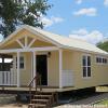 The Premier model by Platinum Cottages & RRC Athens. This model is shown with the optional front porch. See above for the floorplan, pricing and a virtual tour of this model currently on display in Athens TX.