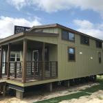 The Tumbleweed model P-576 by Platinum Cottages on display @ RRC Athens. This 15' wide park model features a shed style front porch roof, a huge loft and a king sized downstairs bedroom.